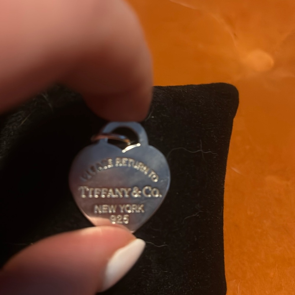 Please return to Tiffany and Co. Sterling silver large charm